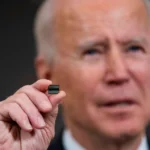 President Joe Biden displays a semiconductor during a White House press conference, February 24, 2021. (Doug Mills / Pool / Getty Images)