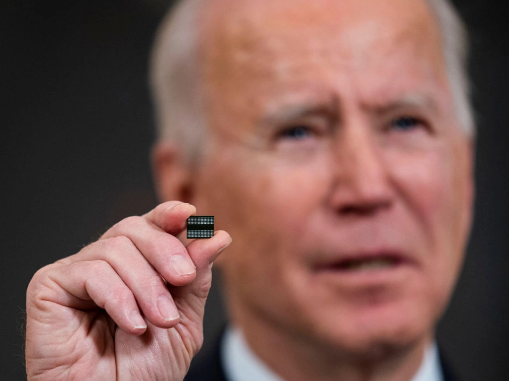President Joe Biden displays a semiconductor during a White House press conference, February 24, 2021. (Doug Mills / Pool / Getty Images)